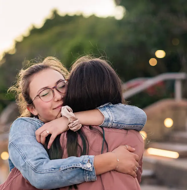 Friends embracing